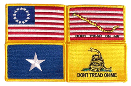 a photo of four historical flag patches