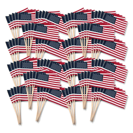 a photo of many USA miniature cotton flags laid out against a white background